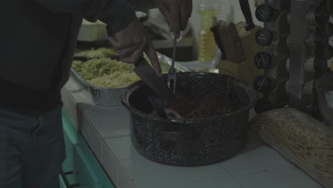 man cuts and serves christmas dinner