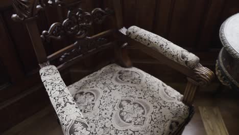 ornate carved wooden armchair