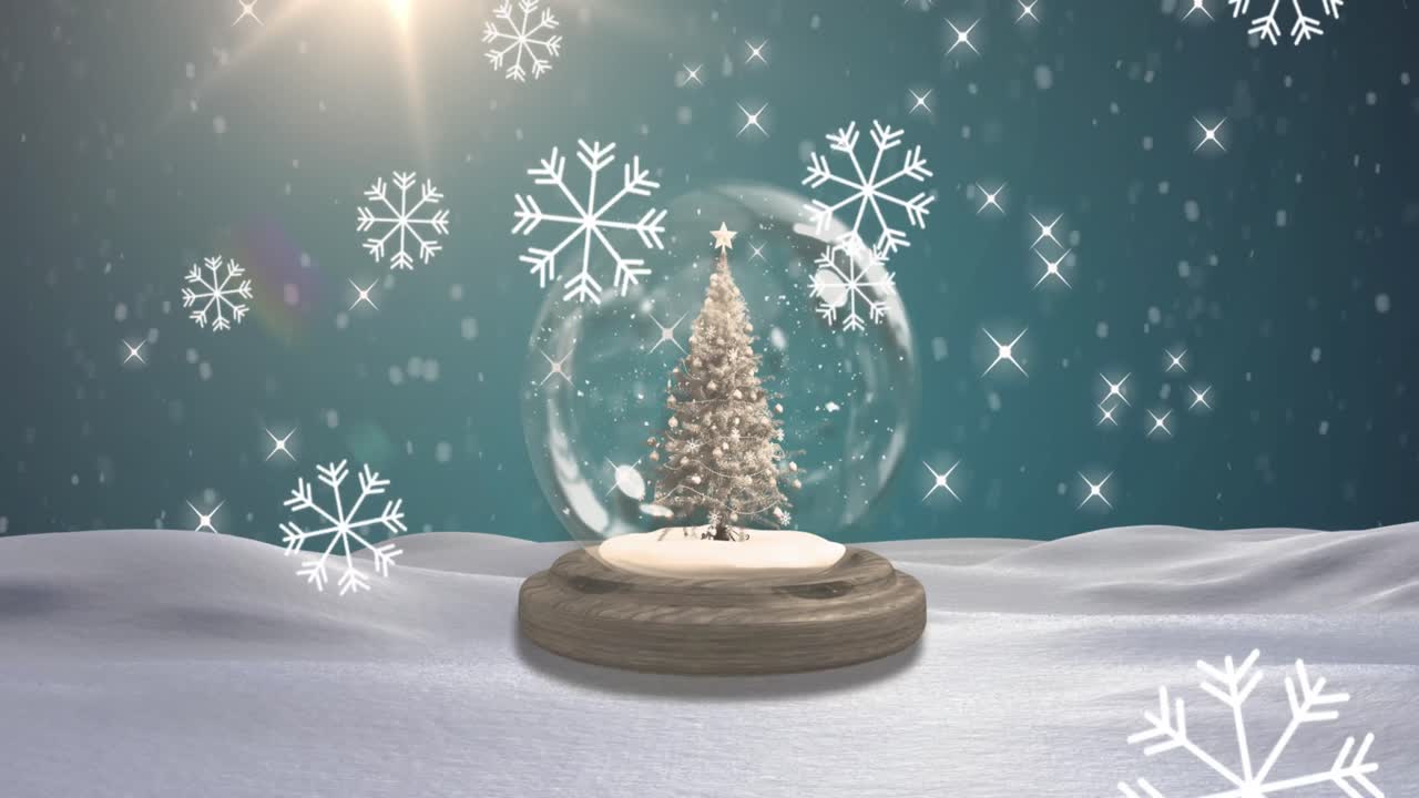 冬景色の中、クリスマスツリーが入ったスノードームの上に雪が降るアニメーション