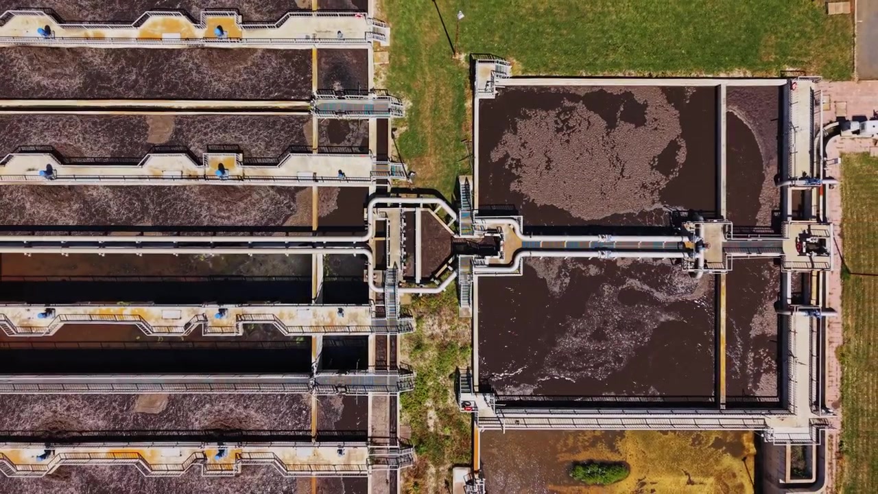 Water treatment facility processes wastewater in urban area during daylight