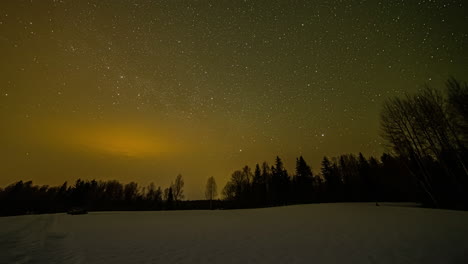 time-lapse of star trail moving and circling in starry and golden sky