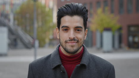 portrait of a smiling man in a coat
