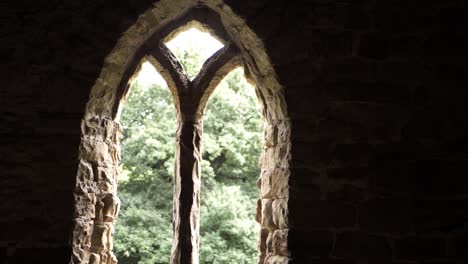 ornate arch window frame on georgian building in england medium tilting shot