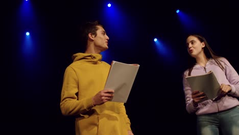 teenagers rehearsing in a theatre