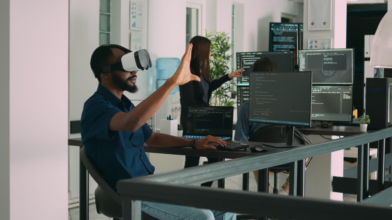 Male app developer using virtual reality glasses to code new server interface