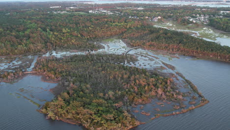 Aerial-drone-shot-of-the-salt-marsh-or-wetlands-with-bridges-for-people