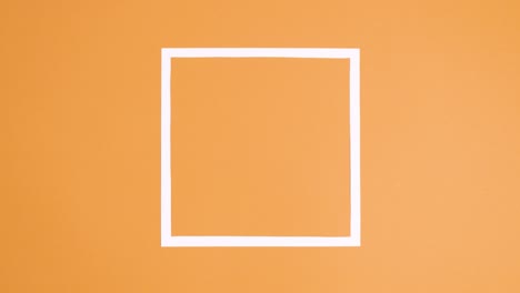zanahorias brillantes haciendo fotograma espacial de copia para la pascua en fondo naranja. detener el movimiento