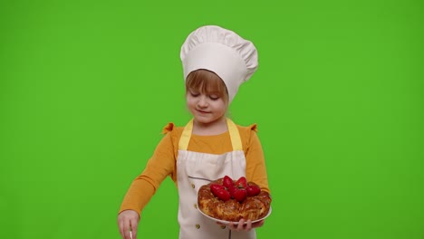 child girl kid dressed as cook chef sprinkle strawberry pie with icing sugar, chroma key background