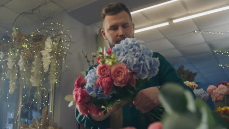 two florists together create beautiful bouquet