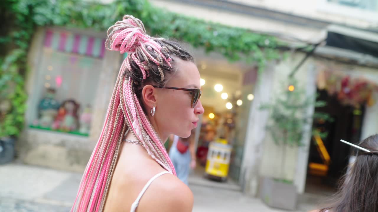 People with Pink Braids in Urban Setting