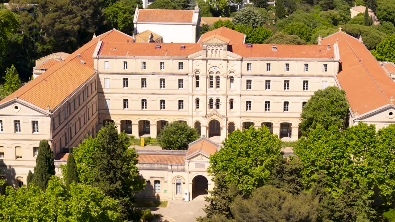 classic architecture with red tile roofs and arched windows in Montpellier