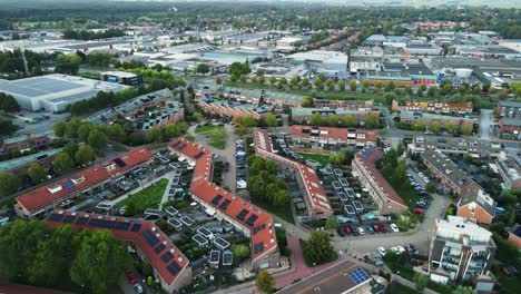 aerial view of a small suburban neighborhood with a lot of solar panels on rooftop