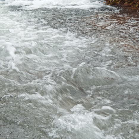 white mountain stream water falling down