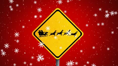 digital animation of snowflakes falling over signboard with black silhouette of santa claus