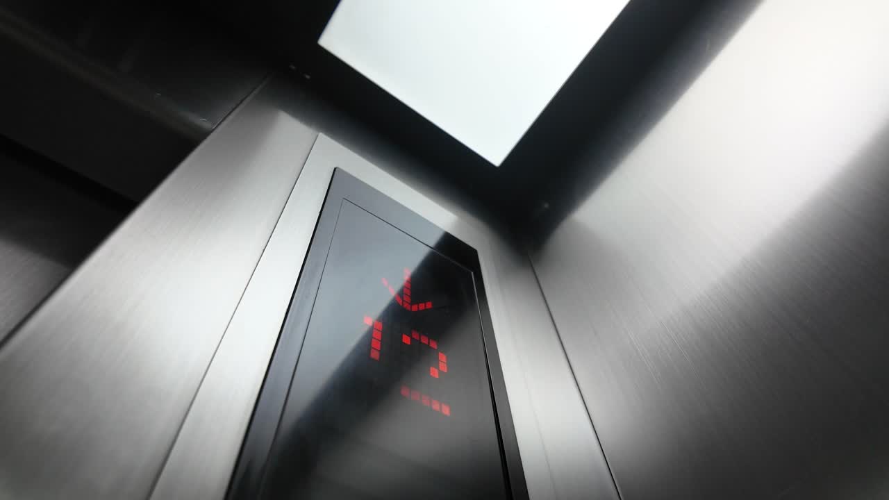 Elevator display with arrow indicating direction and floor number