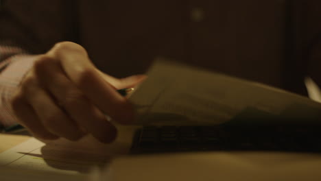person reading documents at night