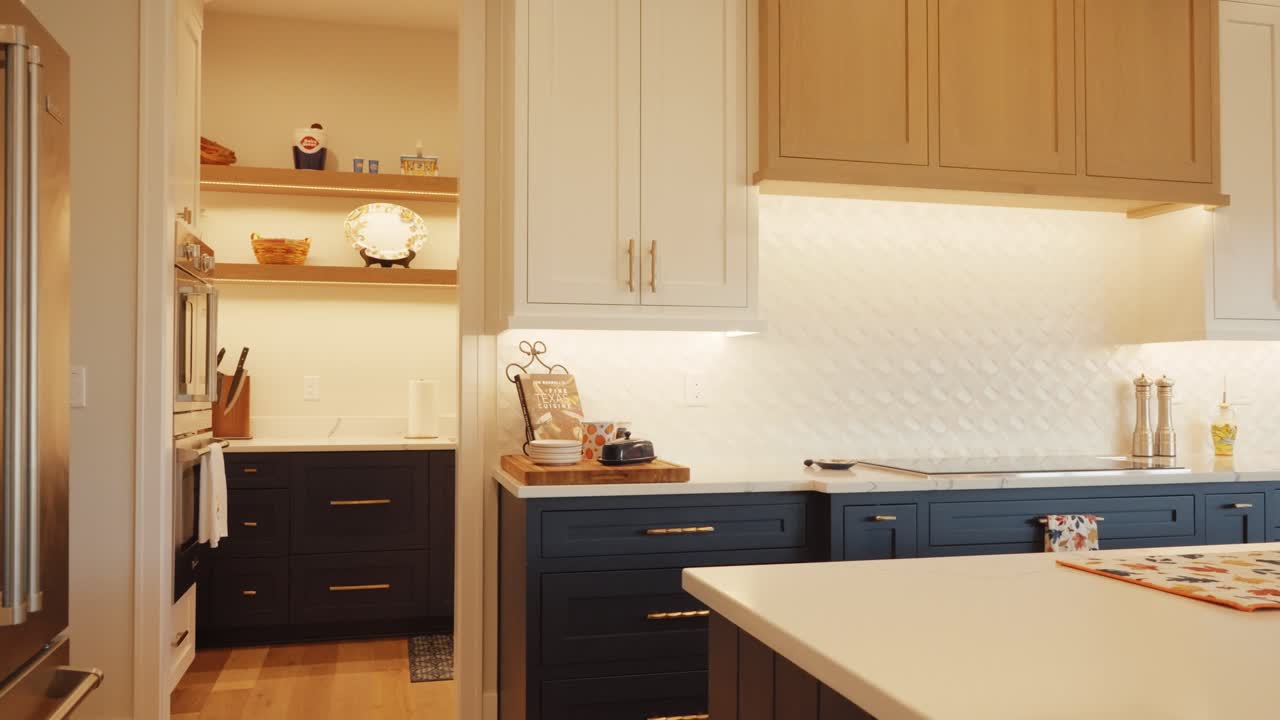 Contemporary kitchen space with colourful luxury wooden units and stylish clean room layout
