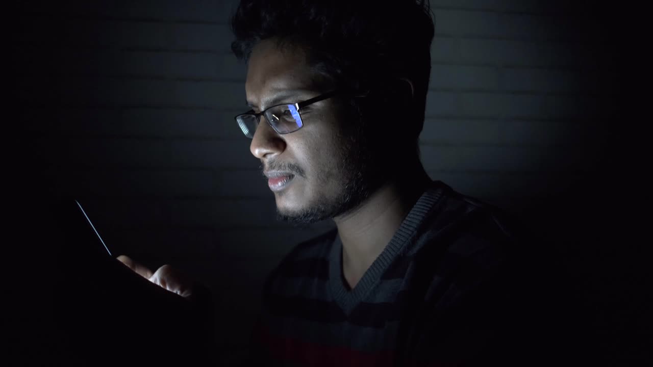 Man using smartphone at night | Premium Stock Video Footage