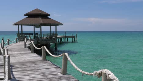 a beautiful gazebo on a pier in the open ocean in asia