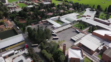 orbital aerial view of bustling bus station, city transportation hub