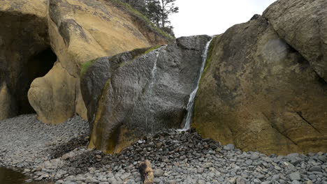 waterfall at hug point at the oregon coast, state park near cannon beach