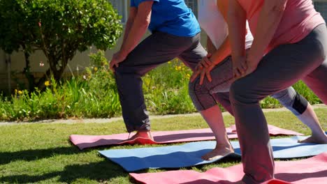 Low-section-of-senior-people-exercising-in-the-garden-of-nursing-home-4k