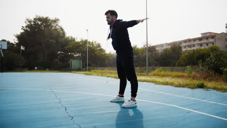 stretching before a basketball match at the park