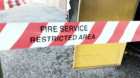 fire service restricted area tape cordons off suspected exploded bin, brisbane australia