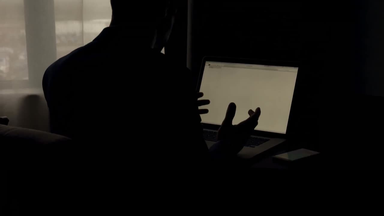 Businessman working on laptop 4k