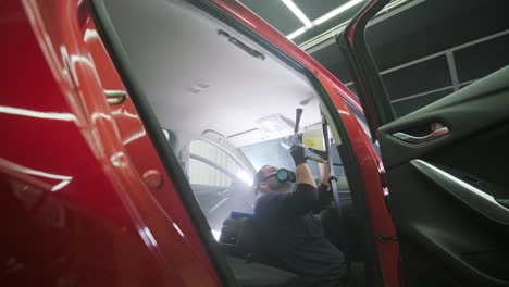 professional car cleaning. сar wash. interior detailing. dry clean and detail a car interior. deep seats cleaning. wiping foam in car wash. cleaning the car panel from dust. a vacuum cleaner