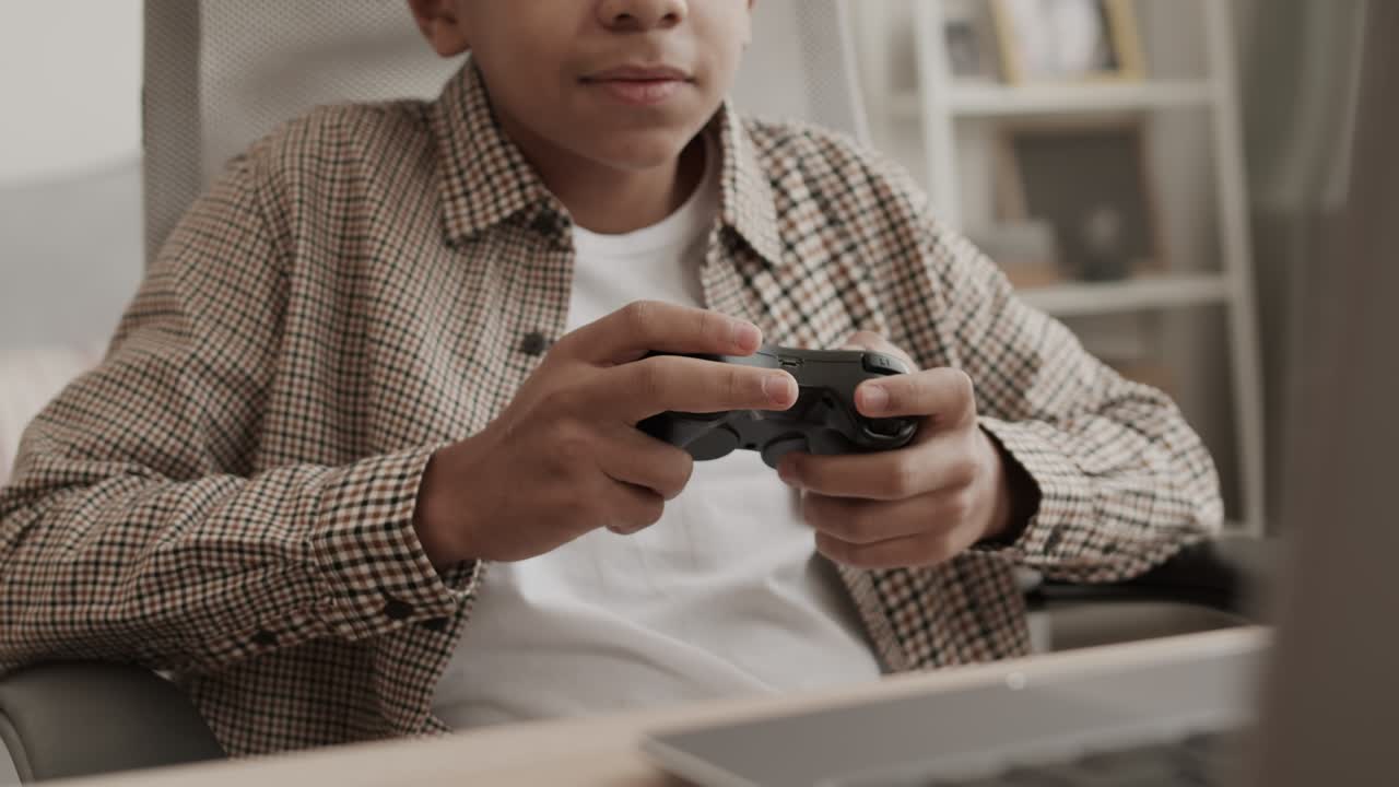 Boy Playing Game with Console Controller