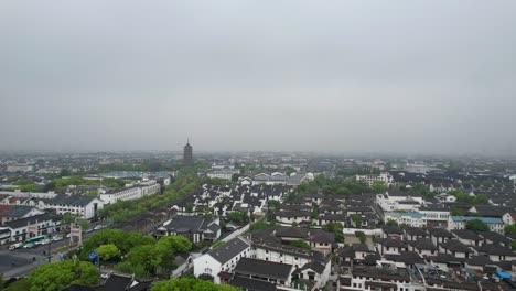 Suzhou-on-a-foggy-day-and-North-Pagoda-amid-a-dense-urban-landscape