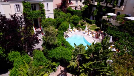 Aerial-View-of-Botanical-Garden-and-Fountain-at-Prestigious-Hotel-with-Pool