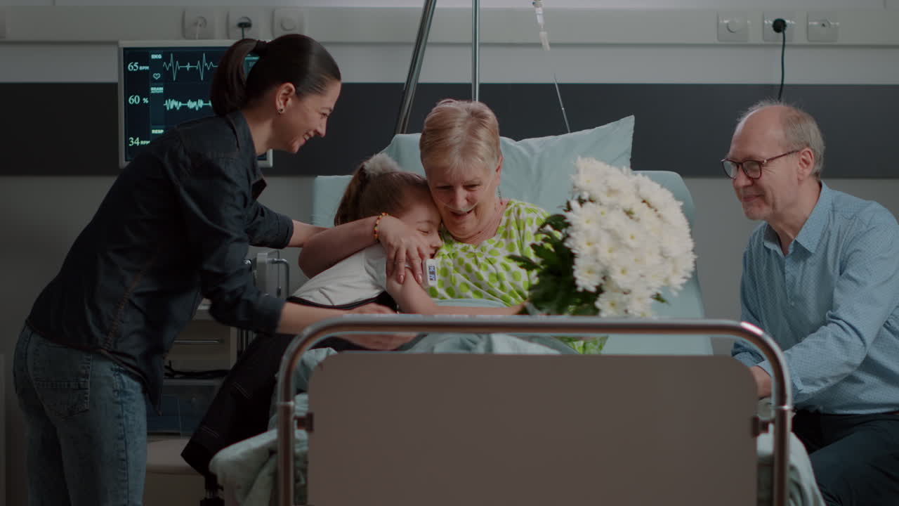 Mother and kid bringing flowers to grandma at visit in hospital ward