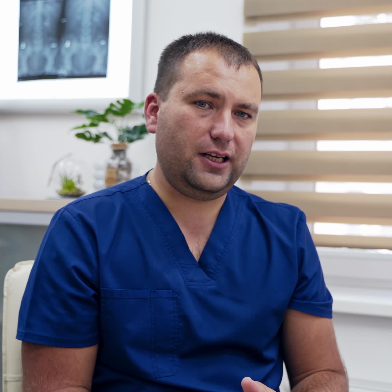 Professional male doctor consulting clients. Happy skilled medical professor educating online. Therapist explains treatment through video chat.