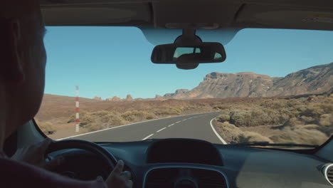 A-road-view-in-mountain-area-from-a-driving-car