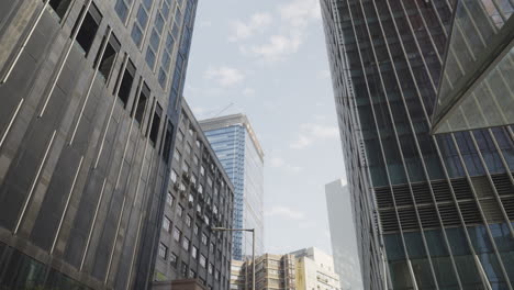 Static-low-angle-shot-of-imposing-skyscrapers-buildings-in-daytime