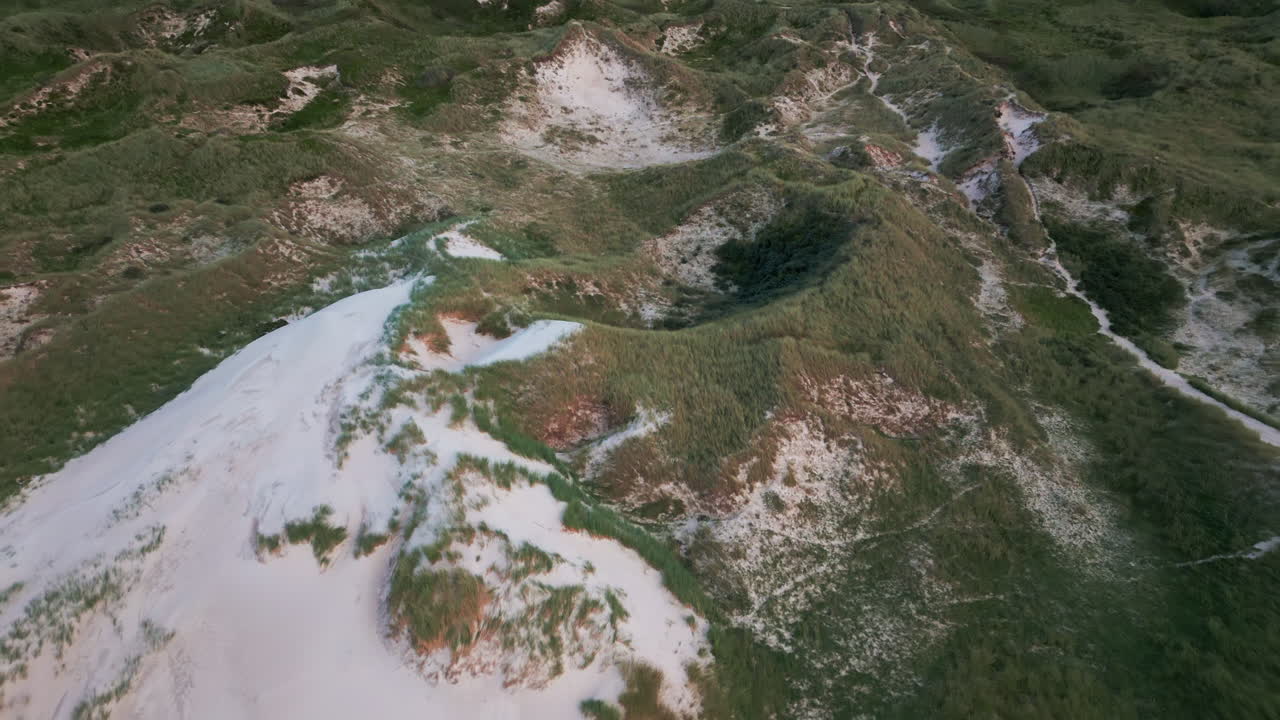 Aerial view of winding paths through Denmark's coastal dune system