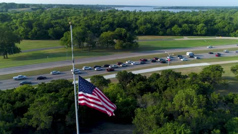 drone view of us flag at half-staff, flying around flag counterclockwise