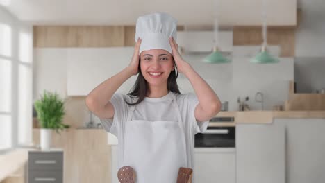 happy indian chef wearing hat