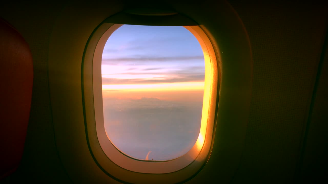 Cloud Window seat airplane concept. Sky cloud view from Seat airplane close up window on sunset beautiful. It sky blue or azure sky and cloud over land in daytime beauty.