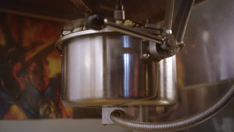 ready popcorn falling out of popcorn machine