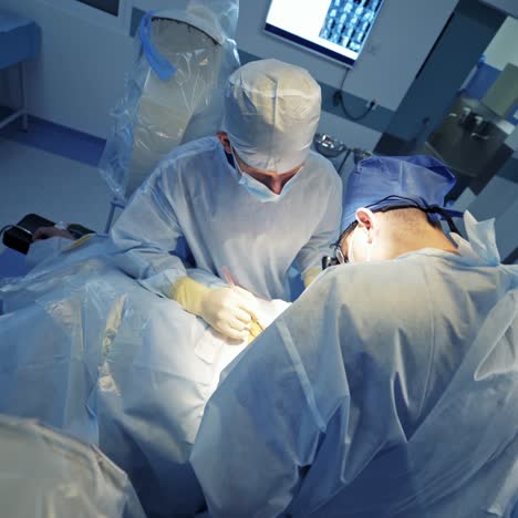 surgeons working on patient in operating room. modern equipment in operating room