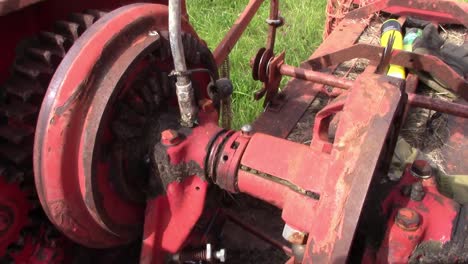 greasing the knotter drive on an old baler for making small square bales