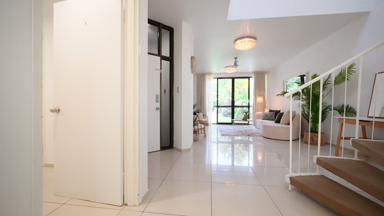 Orbit reveal of Loft Style Kitchen To Second Living Area Past Spiral Staircase. Interior of house home for real estate property.
