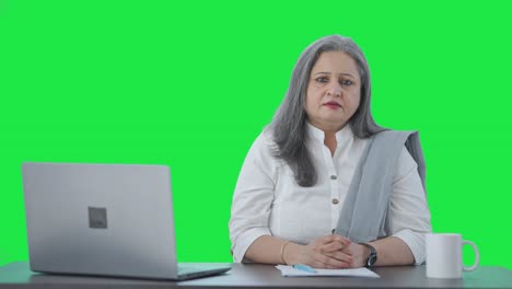 Serious-Indian-senior-businesswoman-staring-at-the-camera-Green-screen