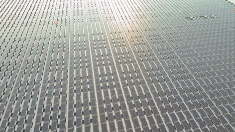 panorama aerial view of floating solar energy panels on a lake