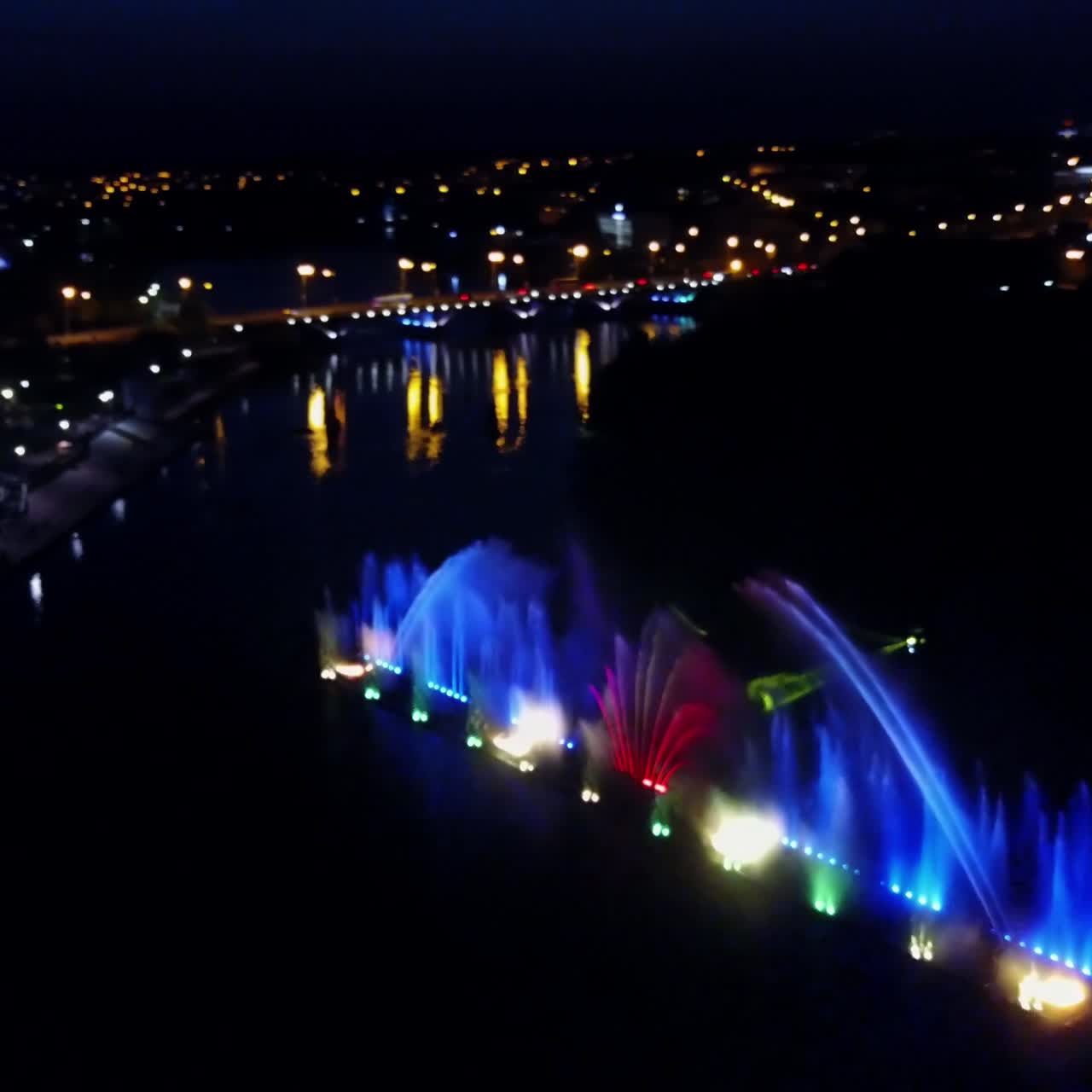 Dancing Water Fountain Show. Aerial shot of the musical fountain with colorful illuminations at night