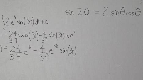 animation of mathematical equation and drawings over white paper