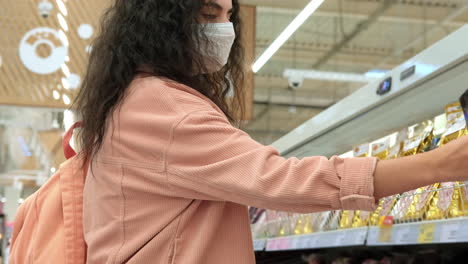 woman shopping for food in supermarket